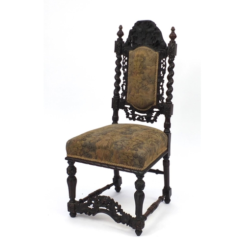 2141 - Antique oak high back chair in the Gothic style carved with acorns, leaves and barley twist supports... 