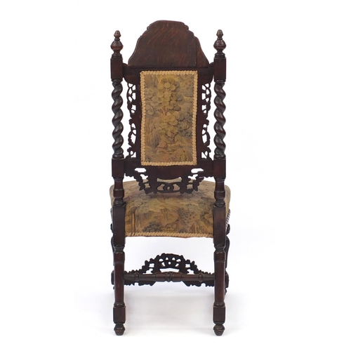 2141 - Antique oak high back chair in the Gothic style carved with acorns, leaves and barley twist supports... 