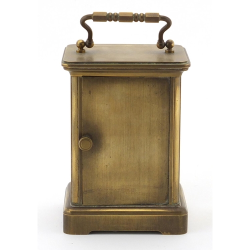 2469 - Brass cased carriage clock with enamelled dial and Roman numerals, 11cm high