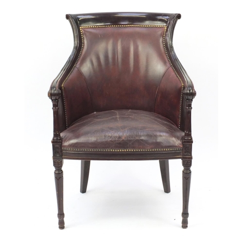 2100 - Mahogany and brown leather library chair on tapering legs, 91cm high