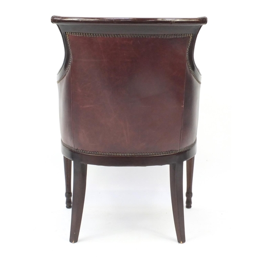 2100 - Mahogany and brown leather library chair on tapering legs, 91cm high