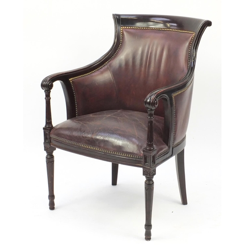 2100 - Mahogany and brown leather library chair on tapering legs, 91cm high