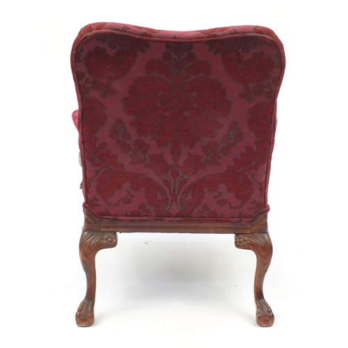2038 - Mahogany framed open armchair with scroll arms, ball and claw feet and red floral upholstery, 93cm h... 