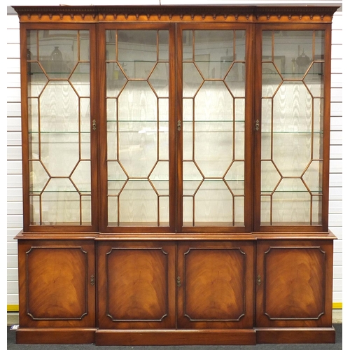 2013 - Mahogany breakfront bookcase, fitted with four astragal glazed doors each enclosing three adjustable... 