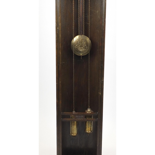 2026 - Arts & Crafts carved oak eight day long case clock striking on a gong, the brass face with Arabic nu... 