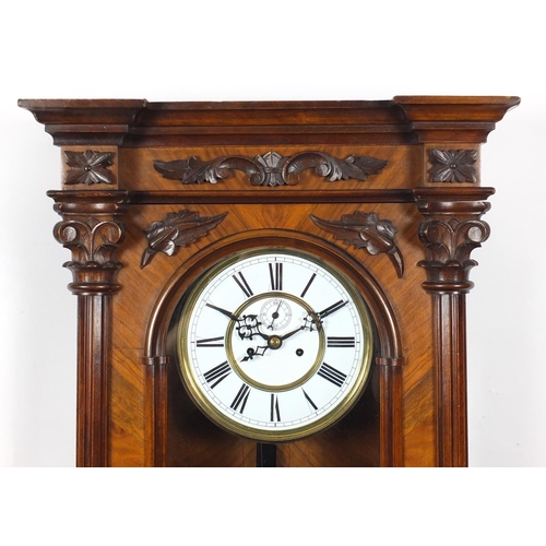 2114 - Walnut Vienna regulator wall clock with enamelled dial, carved with Corinthian columns, 105cm in len... 