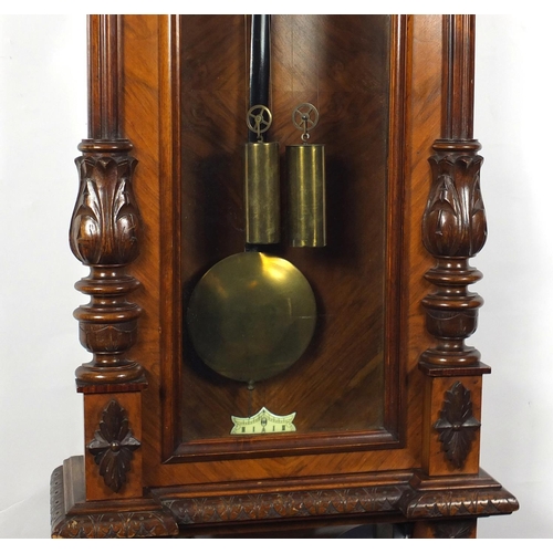 2114 - Walnut Vienna regulator wall clock with enamelled dial, carved with Corinthian columns, 105cm in len... 