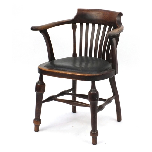 102 - Oak smokers bow armchair with black leatherette seat, 80cm high