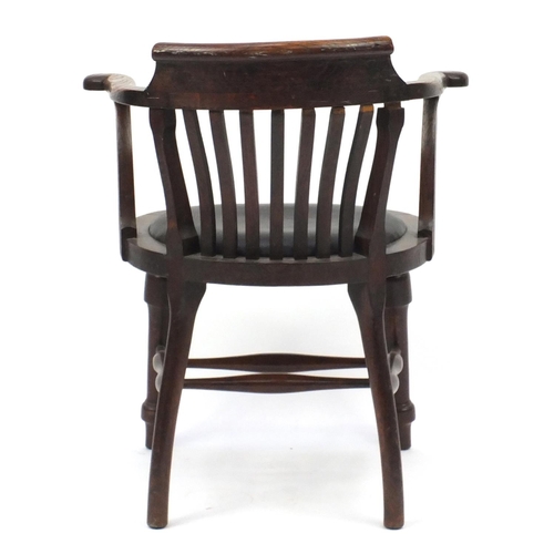 102 - Oak smokers bow armchair with black leatherette seat, 80cm high