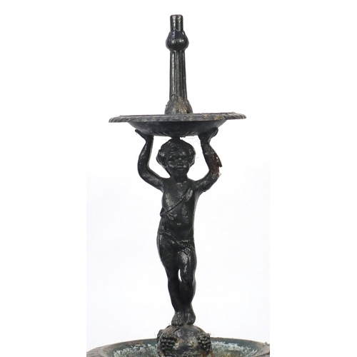 2008 - Victorian cast iron cherub water fountain with dolphin supports, 170cm high