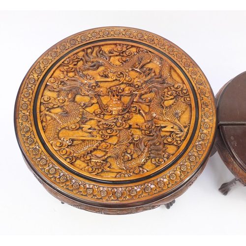 2092 - Chinese circular hardwood nest of five tables, the largest carved with two dragons chasing a flaming... 