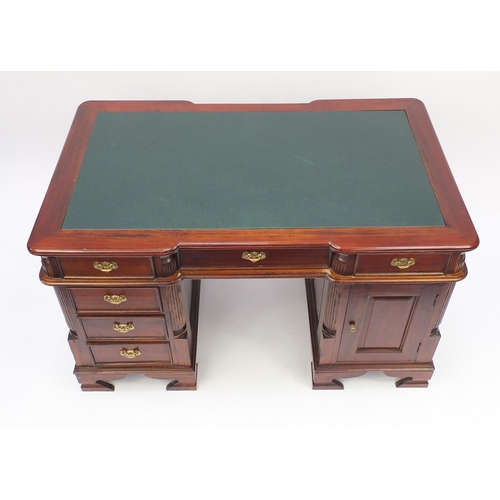 2009 - Mahogany twin pedestal desk with green leather insert, fitted with six drawers and a cupboard door, ... 