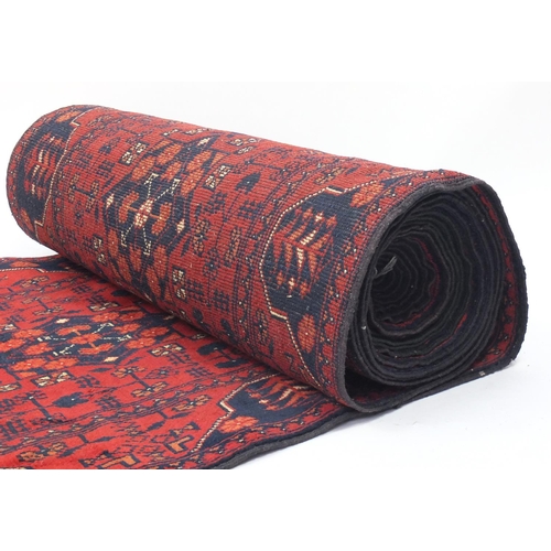 2022 - Good Afghan Bashir carpet runner, approximately 940cm x 78cm wide
