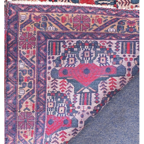 2072 - Rectangular Iran Afshar rug, having an all over stylised design, 145cm x 117cm