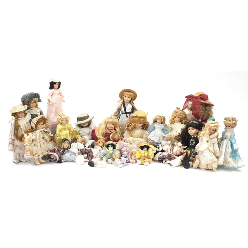 822 - Large collection of mostly bisque head collectors dolls on stands