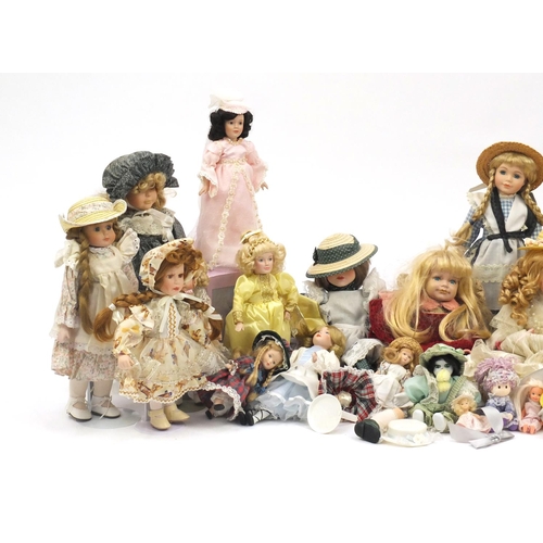 822 - Large collection of mostly bisque head collectors dolls on stands