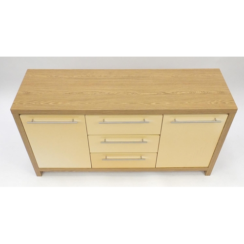 49 - Light oak and melamine sideboard fitted with three drawers and two cupboard doors, 75.5cm H x 139.5c... 