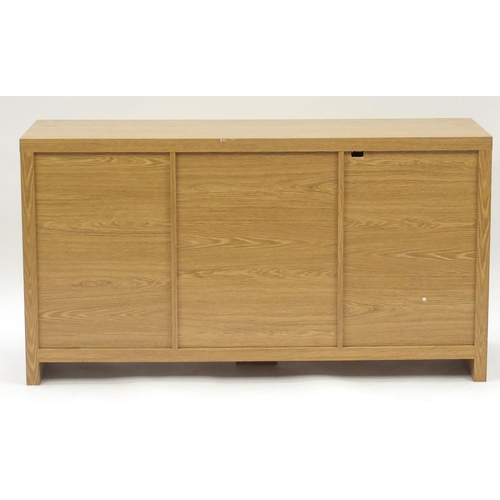 49 - Light oak and melamine sideboard fitted with three drawers and two cupboard doors, 75.5cm H x 139.5c... 