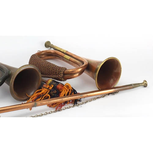 218 - Three copper and brass bugles and a hunting horn