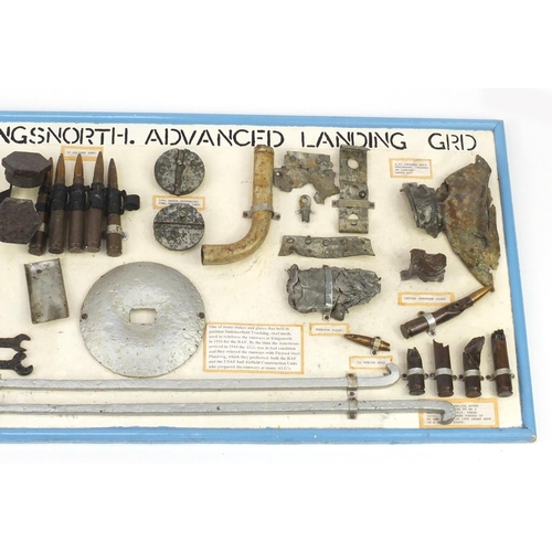 931 - Military interest display of aviation parts found at Kings North Advanced Landing Strip