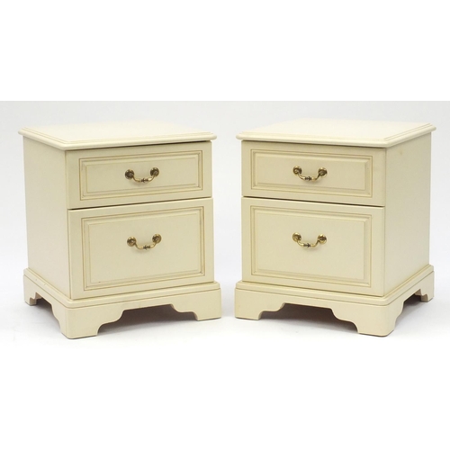 21 - Pair of cream painted wood two drawer bedside chests, 55cm H x 46cm W x 46cm D