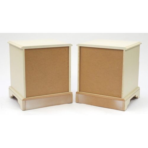 21 - Pair of cream painted wood two drawer bedside chests, 55cm H x 46cm W x 46cm D