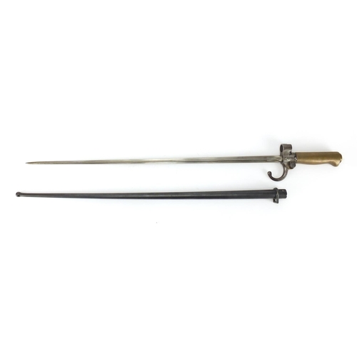 912 - British Military spike bayonet and scabbard, impressed numbers to the hilt and scabbard, 65cm in len... 