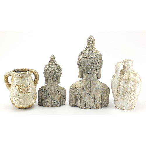 606 - Two pottery Thai Buddha busts and two stoneware vessels, the largest 37cm high
