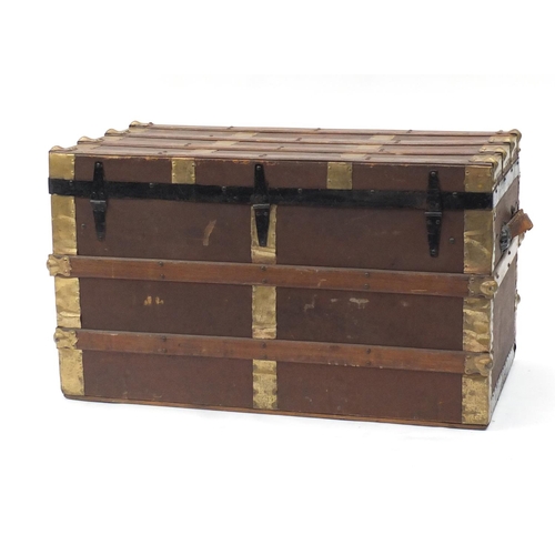 8 - Large metal bound wooden travelling trunk with brass fittings, 51cm H x 87cm W x 47cm D