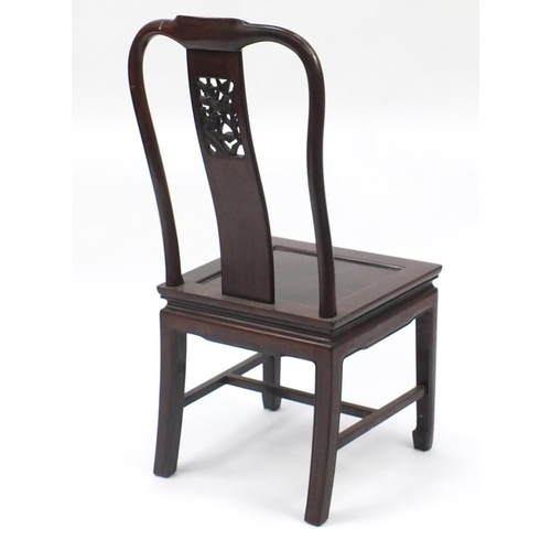 48 - Chinese hardwood occasional chair, the back carved with a bird amongst flowers, 97cm high