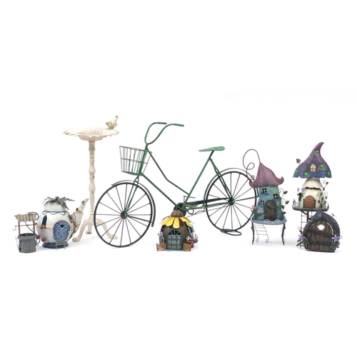 820 - Group of novelty painted metal garden ornaments, bicycle planter and wrought iron bird bath, the lar... 