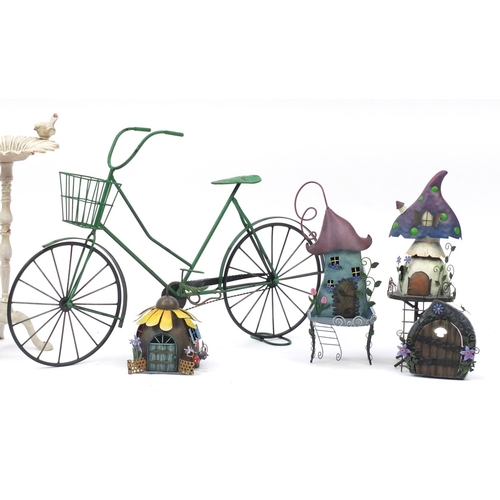 820 - Group of novelty painted metal garden ornaments, bicycle planter and wrought iron bird bath, the lar... 