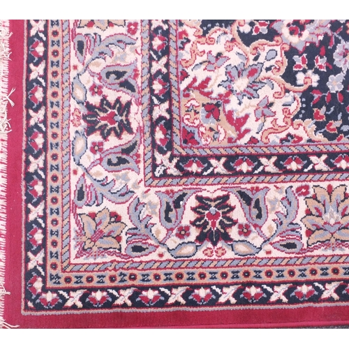26 - Red and cream ground floral patterned rug, 325cm x 240cm