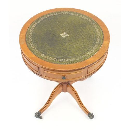 16 - Yew drum table with tooled leather insert and brass paw feet, 58.5cm high x 48.5cm in diameter