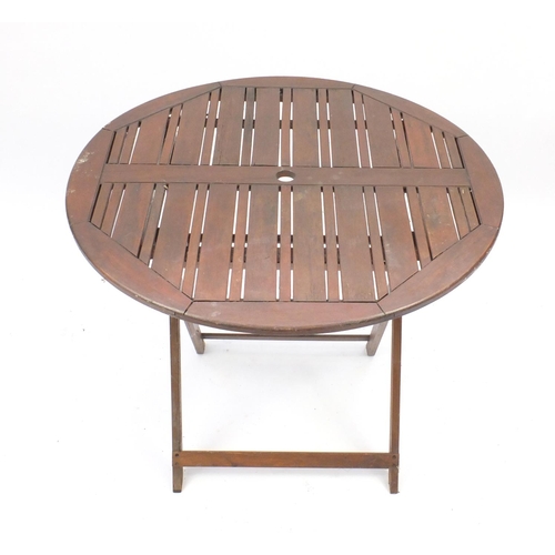 5 - Folding teak garden table and four chairs