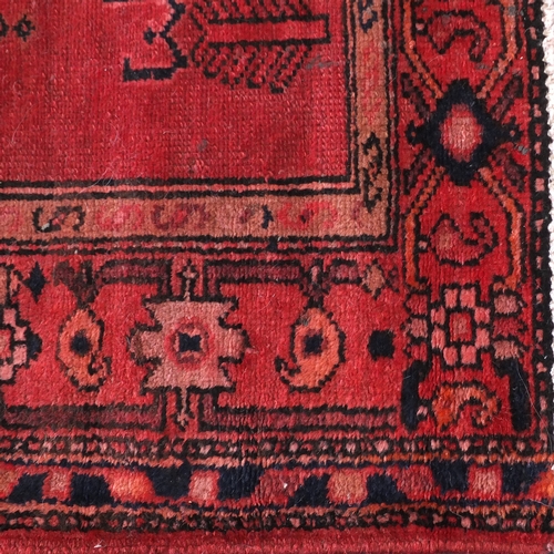 40 - Rectangular Persian Hamadan rug, having an all over geometric design onto predominantly red and blue... 