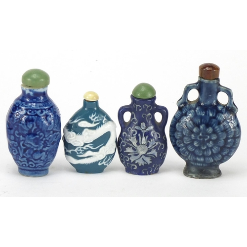 674 - Five Chinese porcelain snuff bottles with stoppers, the largest 8cm high