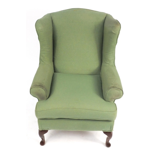 164 - Mahogany framed wingback armchair, with green and gold upholstery, 107cm high