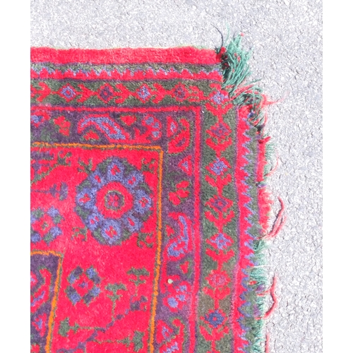 15A - Turkish Oushak carpet, decorated with geometric motifs onto a red ground, 400cm x 330cm