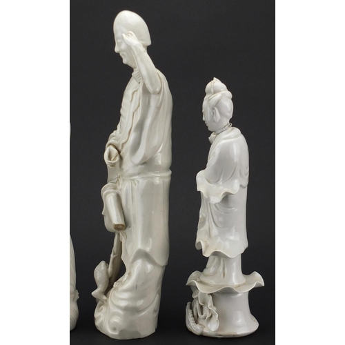 164 - Two Chinese blanc de chine of Guanyin and an example of a monk, the largest 38cm high