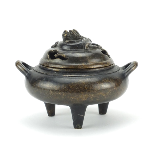 430 - Chinese patinated bronze tripod incense burner and cover with twin handles, character marks to the b... 