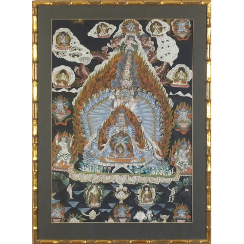 111 - Nepalese thangka hand painted with deities and mythical animals, mounted and framed, 68.5cm x 46.5cm