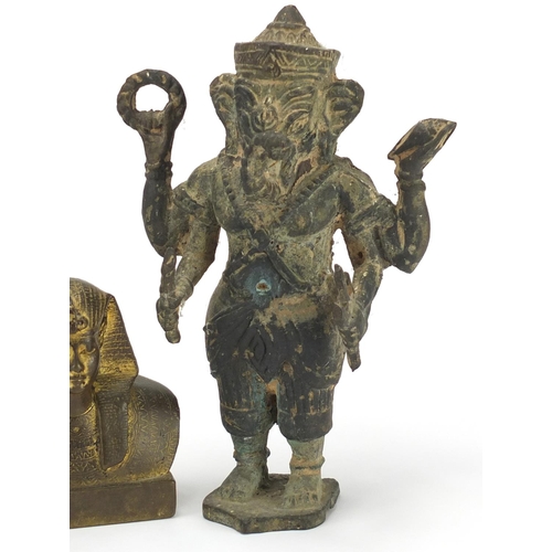 547 - Egyptian gilt bronze sphinx paperweight and an Indian patinated model of Ganesh, the largest 21cm hi... 