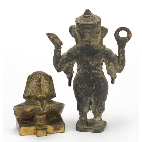 547 - Egyptian gilt bronze sphinx paperweight and an Indian patinated model of Ganesh, the largest 21cm hi... 
