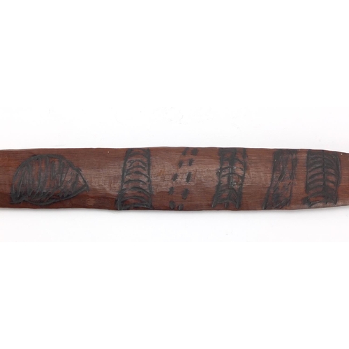 622 - Australian Aboriginal Churinga carved with tribal motifs, 58cm in length