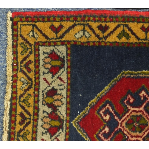 91 - Two Turkish Yastik rugs, each approximately 100cm x 48cm