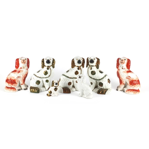260 - Two pairs of Staffordshire pottery seated spaniels and two others, the largest 23cm high