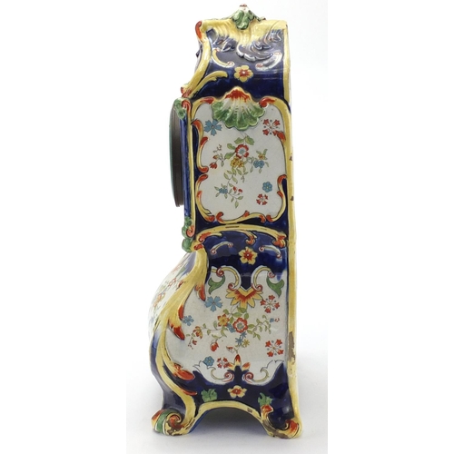 165 - French Quimper pottery mantel clock, decorated with stylised flowers, the enamelled dial with Arabic... 