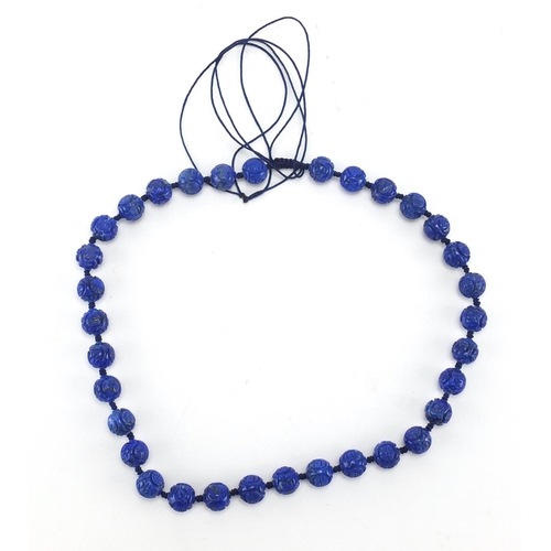 328 - Chinese carved lapis lazuli bead necklace, 46cm in length, approximate weight 77.6g