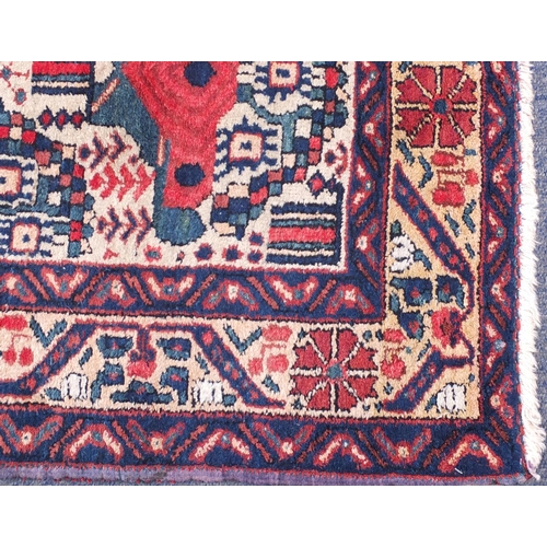 2039 - Rectangular Iran Afshar rug, having an all over stylised design, 145cm x 117cm